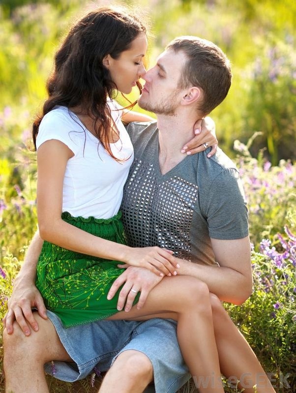 A woman sitting on a man's lap