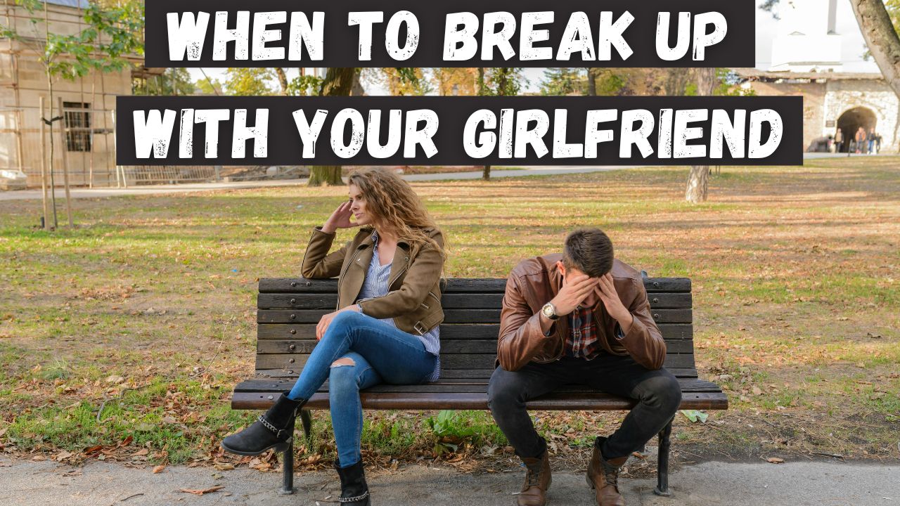A man sitting on a park bench with his girlfriend. They are both sad.