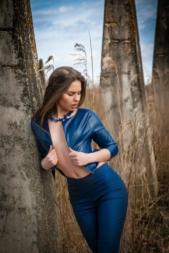 Beautiful woman dressed in blue in the forest